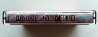ELVIS COSTELLO - "Extreme Honey: The Very Best Of The Warner Bros. Years" -  Cassette Tape (1997) - Mint